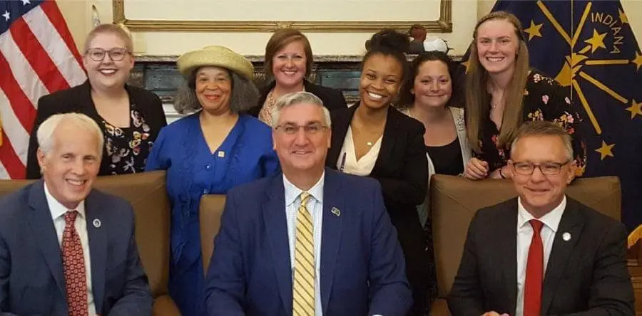 gov_holcomb_and_fellows_caption-01_0