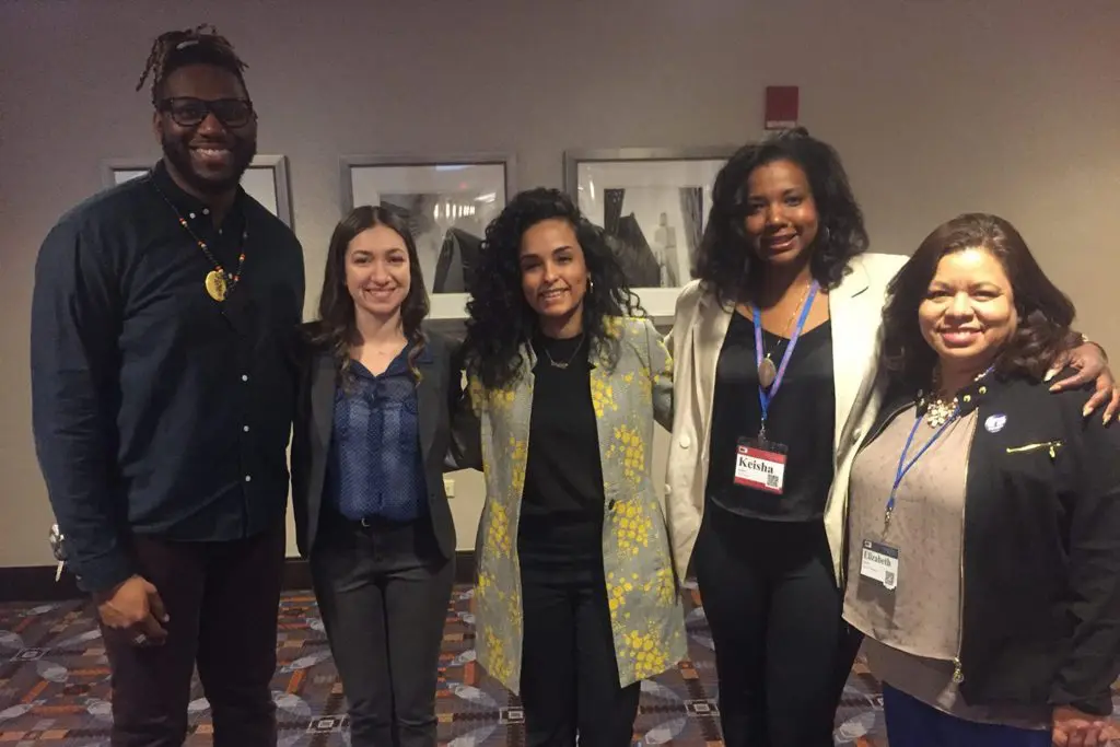 Five teachers of color pose for photo