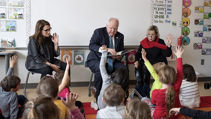 New Rochelle High School educator Geneva Mayne said of Gov. Tim Walz. Above, Walz, along with Minnesota Lt. Gov. Peggy Flanagan, left, and Minnesota First Lady Gwen Walz, right, read to a group of kindergartners at Adams Spanish Immersion Elementary, St. Paul, Minn., Tuesday, January 17, 2023. (Star Tribune via Getty Images)