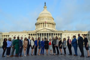 group of people standing in front of US Capitol building